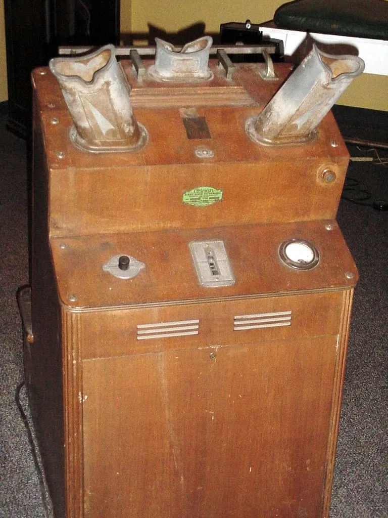 Fig. V — A shoe-fitting fluoroscope of the kind that stood in shoe shops for half a century, showing customers the bones of their own feet in green light.` / credit: `National Museum of Health and Medicine, AFIP - public domain.